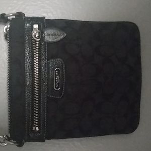 A black coach crossbody bag used still in very good condition